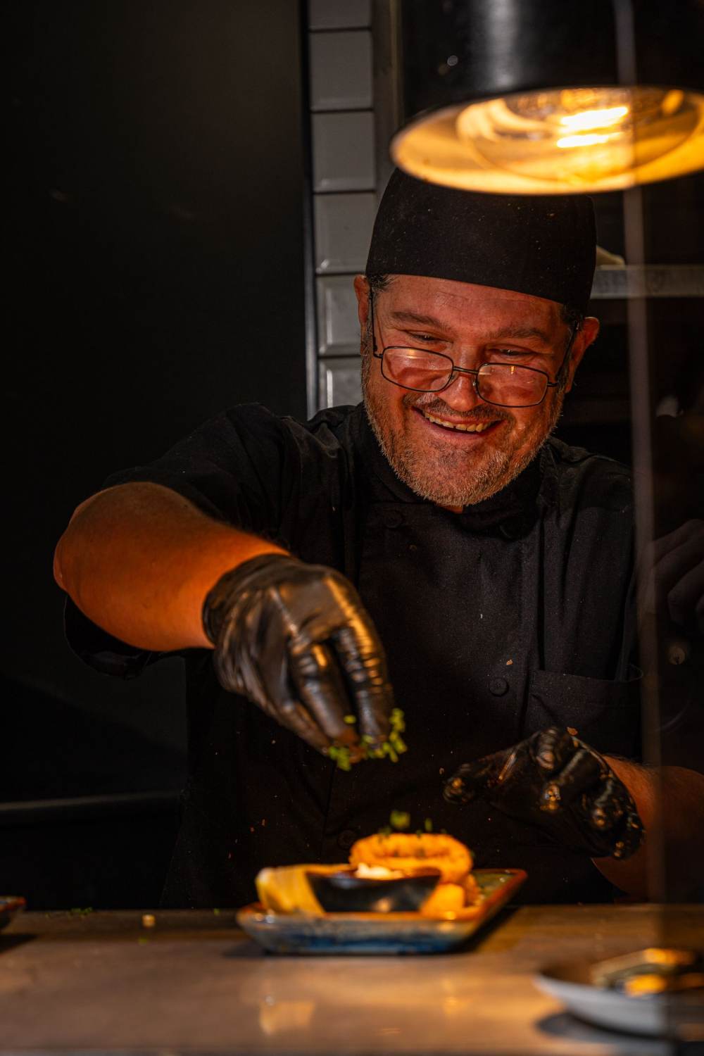 Chef plating a dish at Izgara