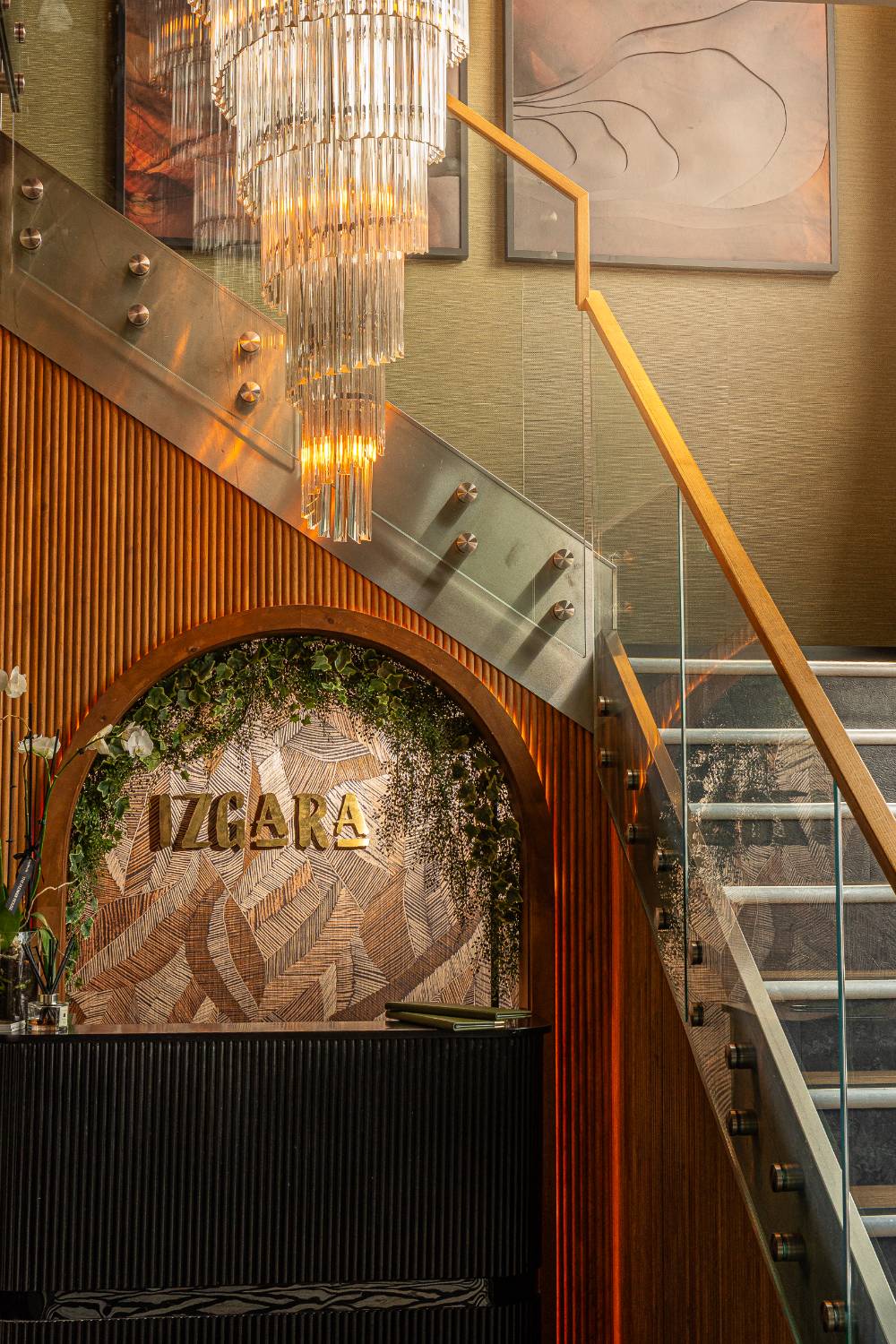 The Izgara entrance, brass lettering beneath the staircase