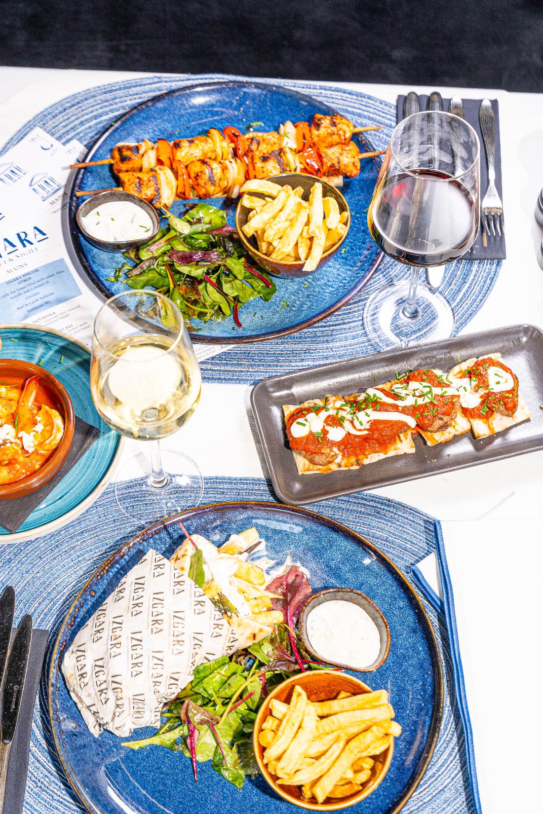 Greek Night table of gyros, souvlaki and mezze