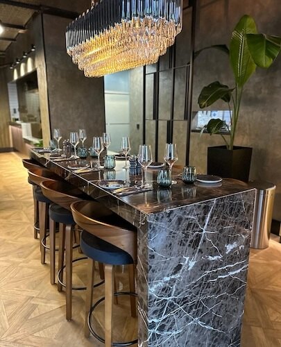 The marble high table at the bar
